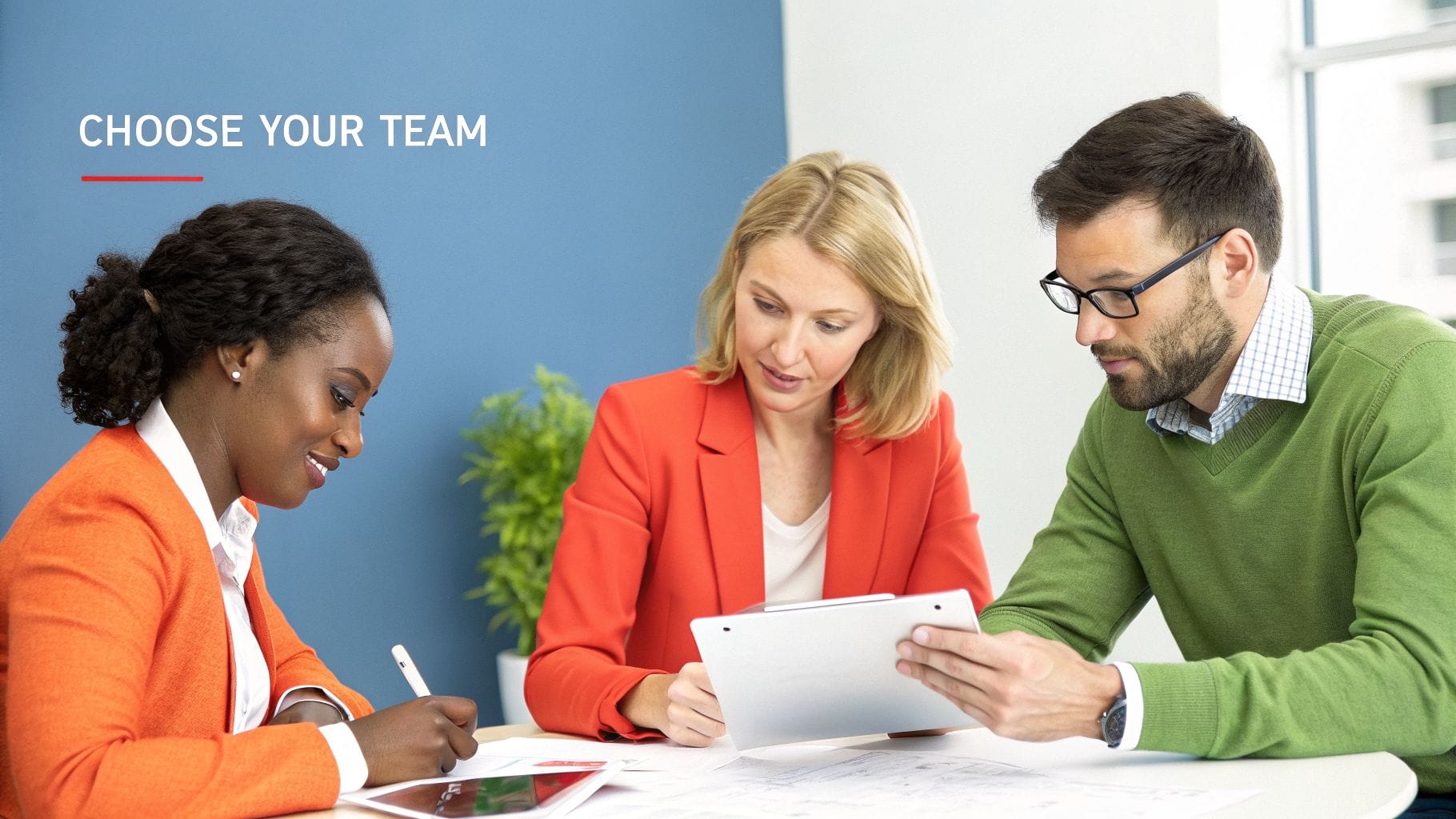Three professionals collaborate at a table, reviewing documents and tablets. One person takes notes while another holds a tablet, all engaged in discussion in a bright, modern office.