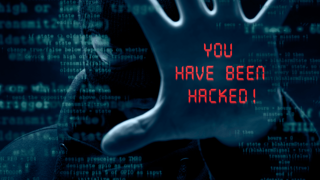 A masked figure reaches out with a hand, superimposed with text reading "YOU HAVE BEEN HACKED!" against a backdrop of green and blue computer code.